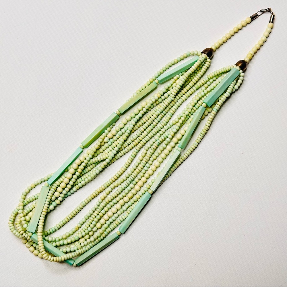 VTG 70s Beaded Necklace Bohemian Layered 8 Strands Light Green Beads Bell Ends